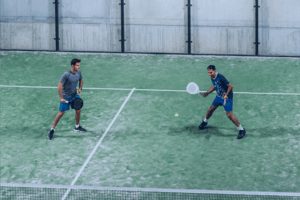 two men playing padel